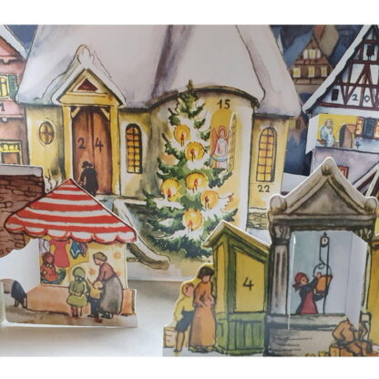 Adventskalender 3D snötäckt stad med korsvirkeshus