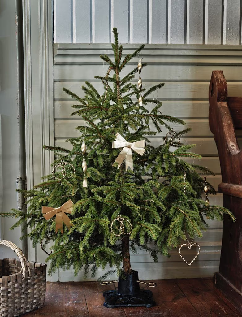 Liten julgransfot i svart gjutjärn